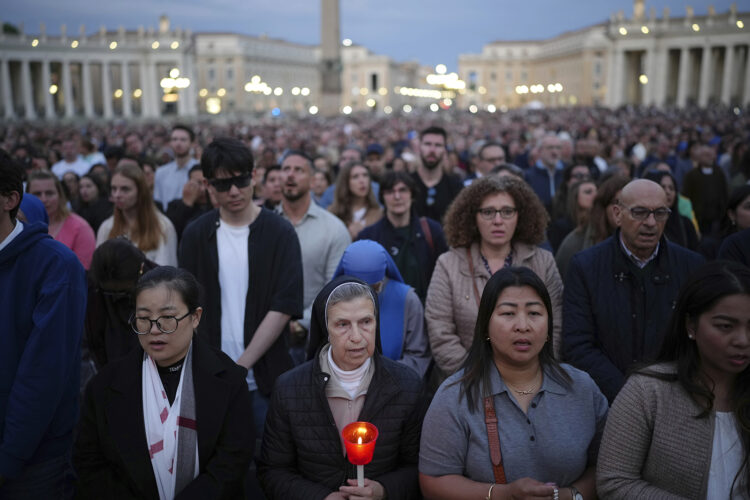 Holding tickets for Rome, Vatican pilgrims pivot from saint canonization to papal funeral